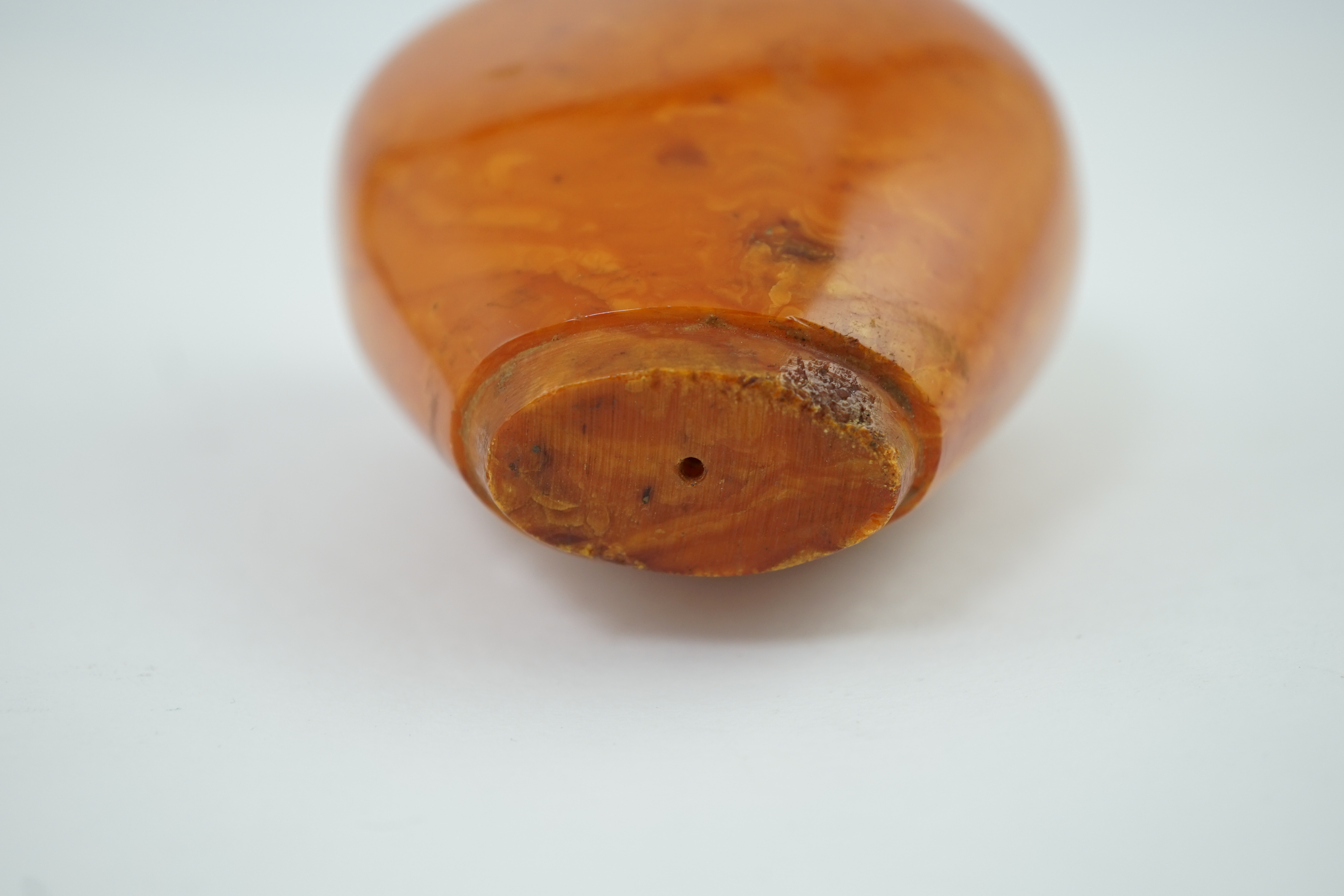 A large amber parasol handle